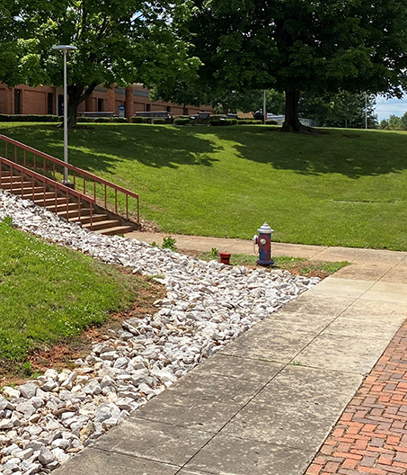 Rocks on ground outside of Student Center to protect erosion from water