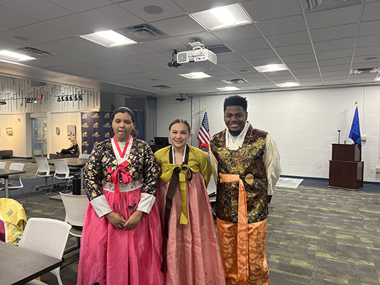 2 women and 1 man with Japan outfits