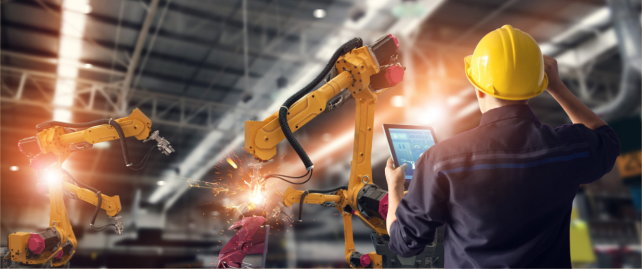 man working on manufacturing equipment