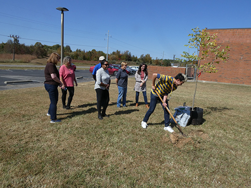 ECTC employees attending the support of planting the tree.
