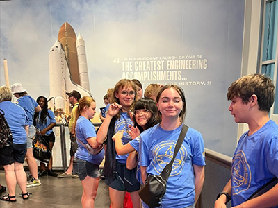 ECTC Students in front of Engineering Accomplishments with Space Center