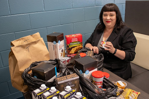 Person with food pantry items