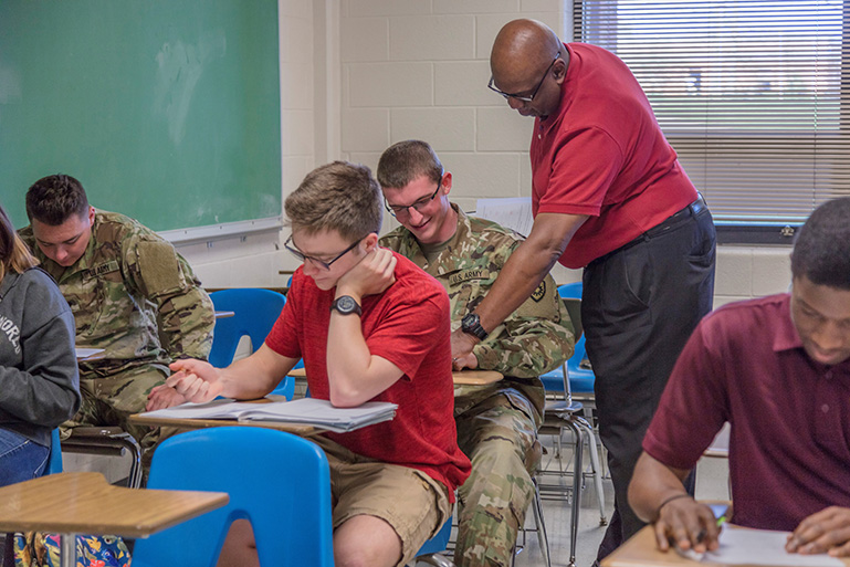 students in a classroom with a professor