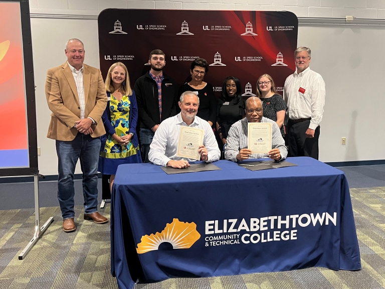 group of ECTC and UofL faculty/staff at the signing