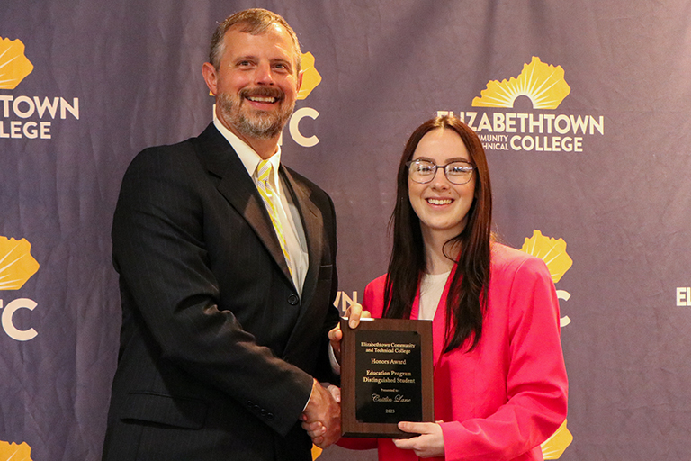 Student honored award with ECTC President Dr. Pate