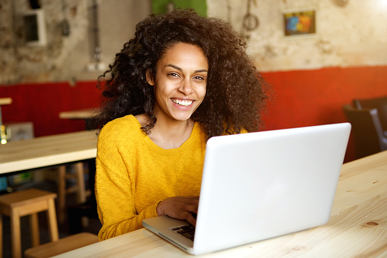 Female student looking online on a computer