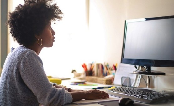 Woman sitting at computer